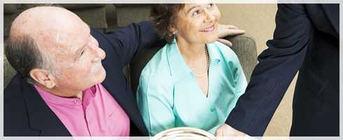 elderly couple meeting a person